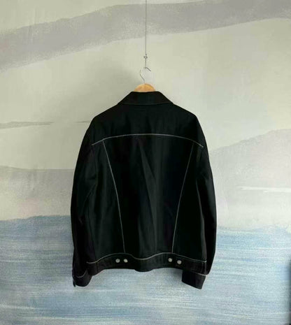 black denim jacket with logo patch