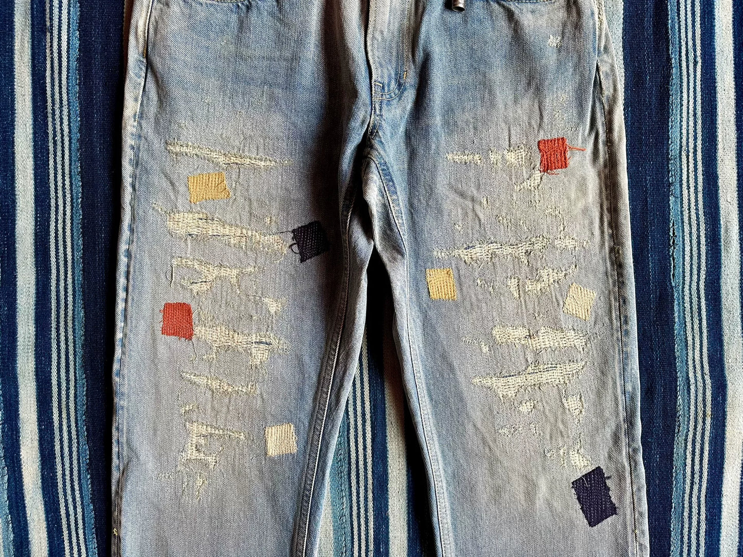 fdmtl slim fit denim distressed patchwork jeans