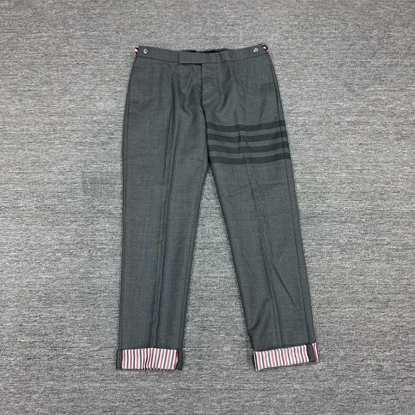 gray striped wool suit trousers by Thom Browne
