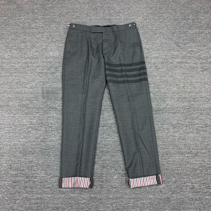 gray striped wool suit trousers by Thom Browne