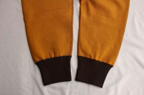 stylish yellow and brown sweatpants