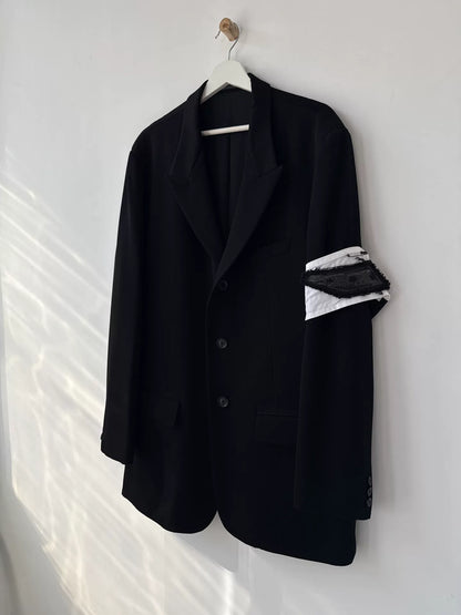 black wool suit jacket with white detail