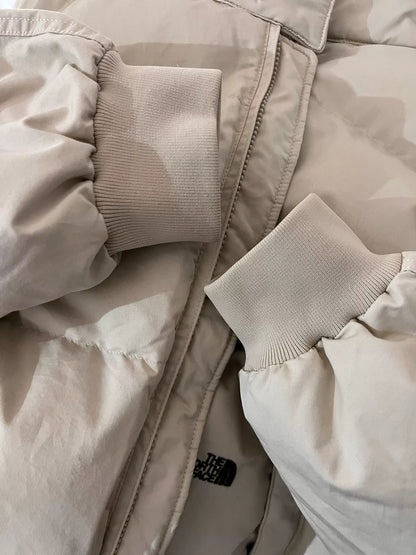 beige north face down jacket
