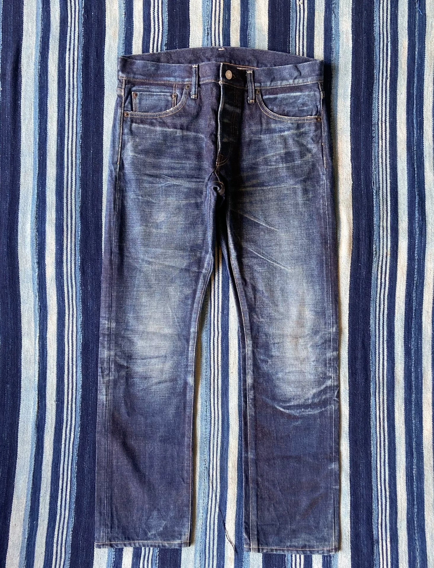 washed vintage-style raw denim jeans
