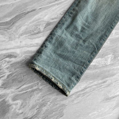 SAINT LAURENT Distressed Blue Jeans