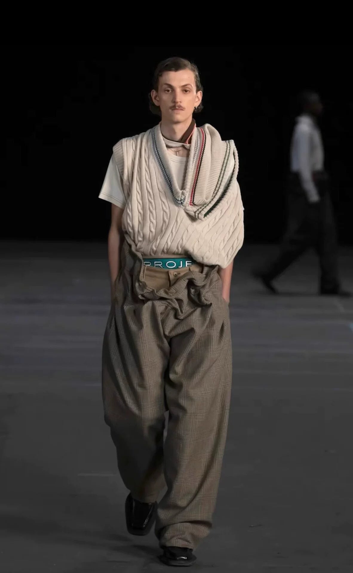 asymmetric knitted vest with multiple collars