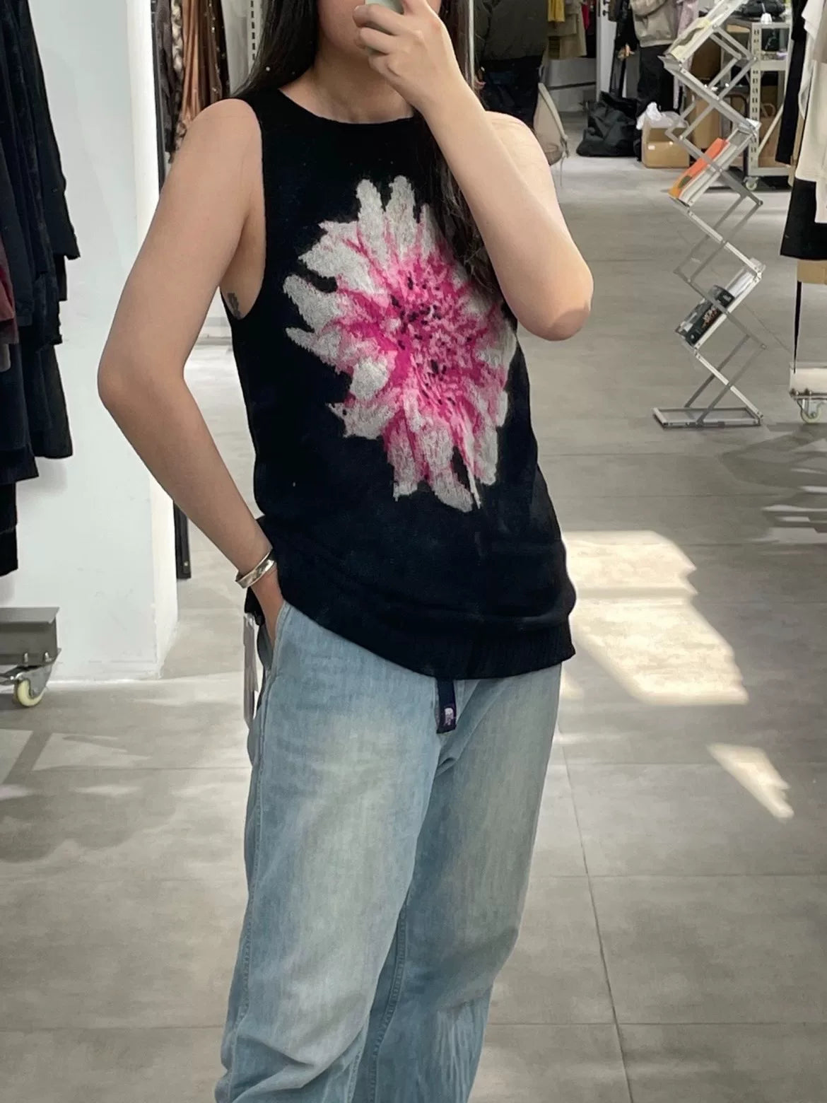 black sleeveless knit vest with floral design