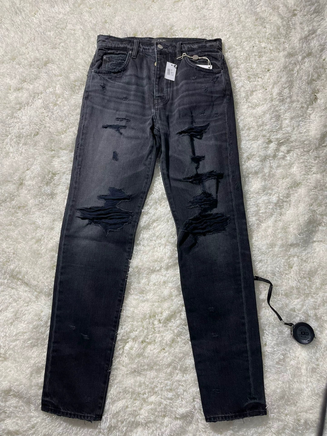 amiri destroyed slouch jeans in black