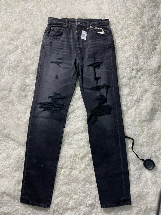 amiri destroyed slouch jeans in black