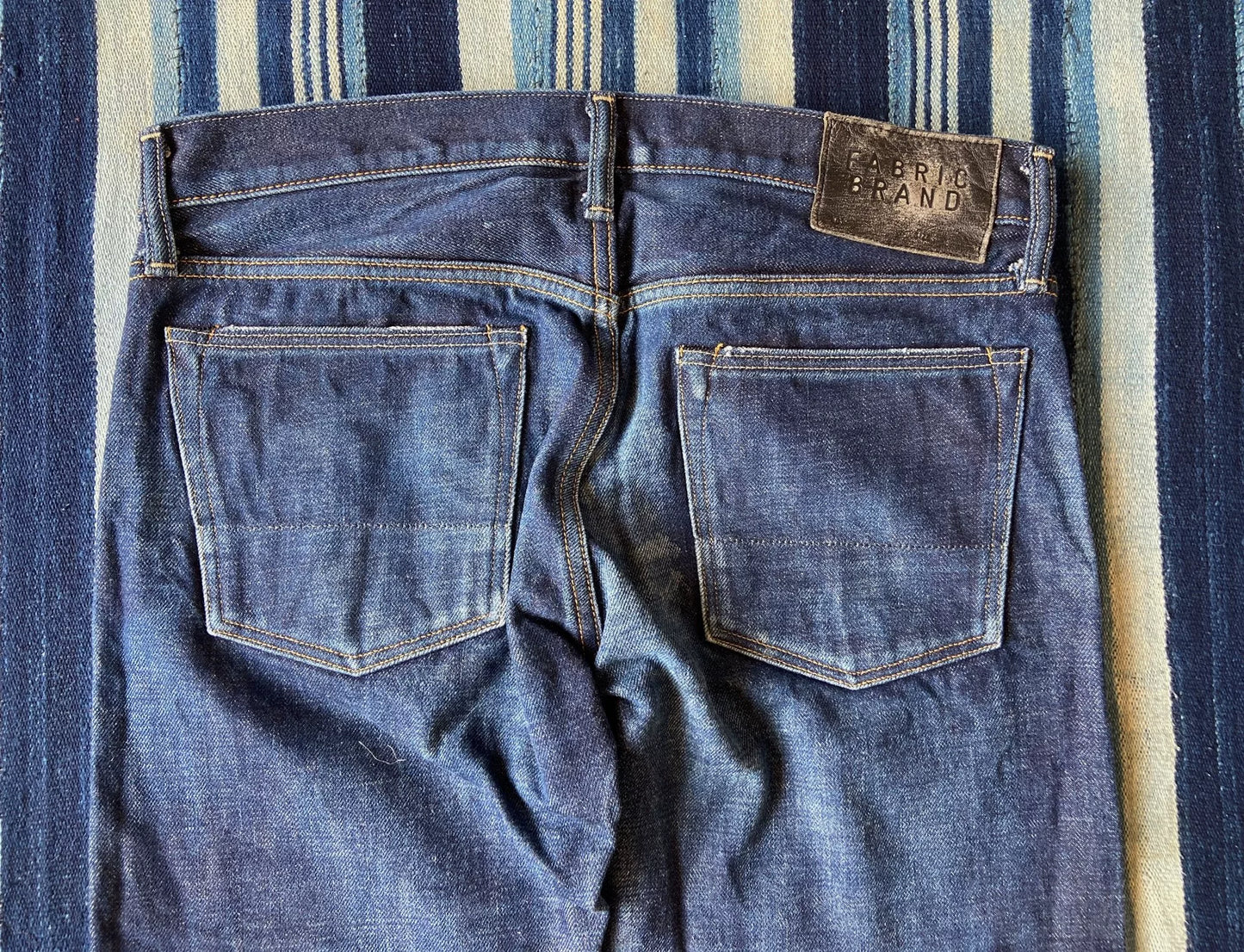 washed vintage-style raw denim jeans