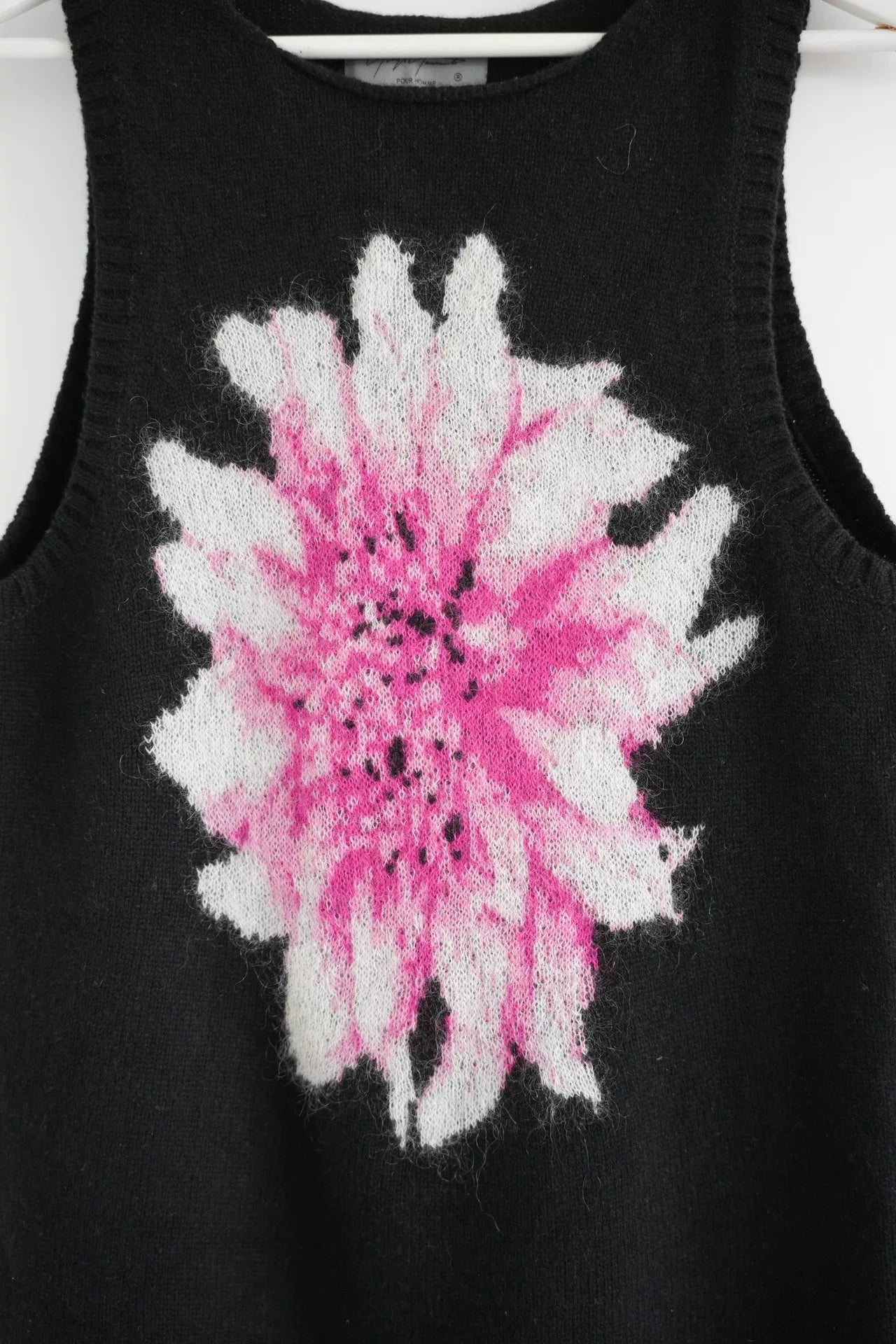 black sleeveless knit vest with floral design
