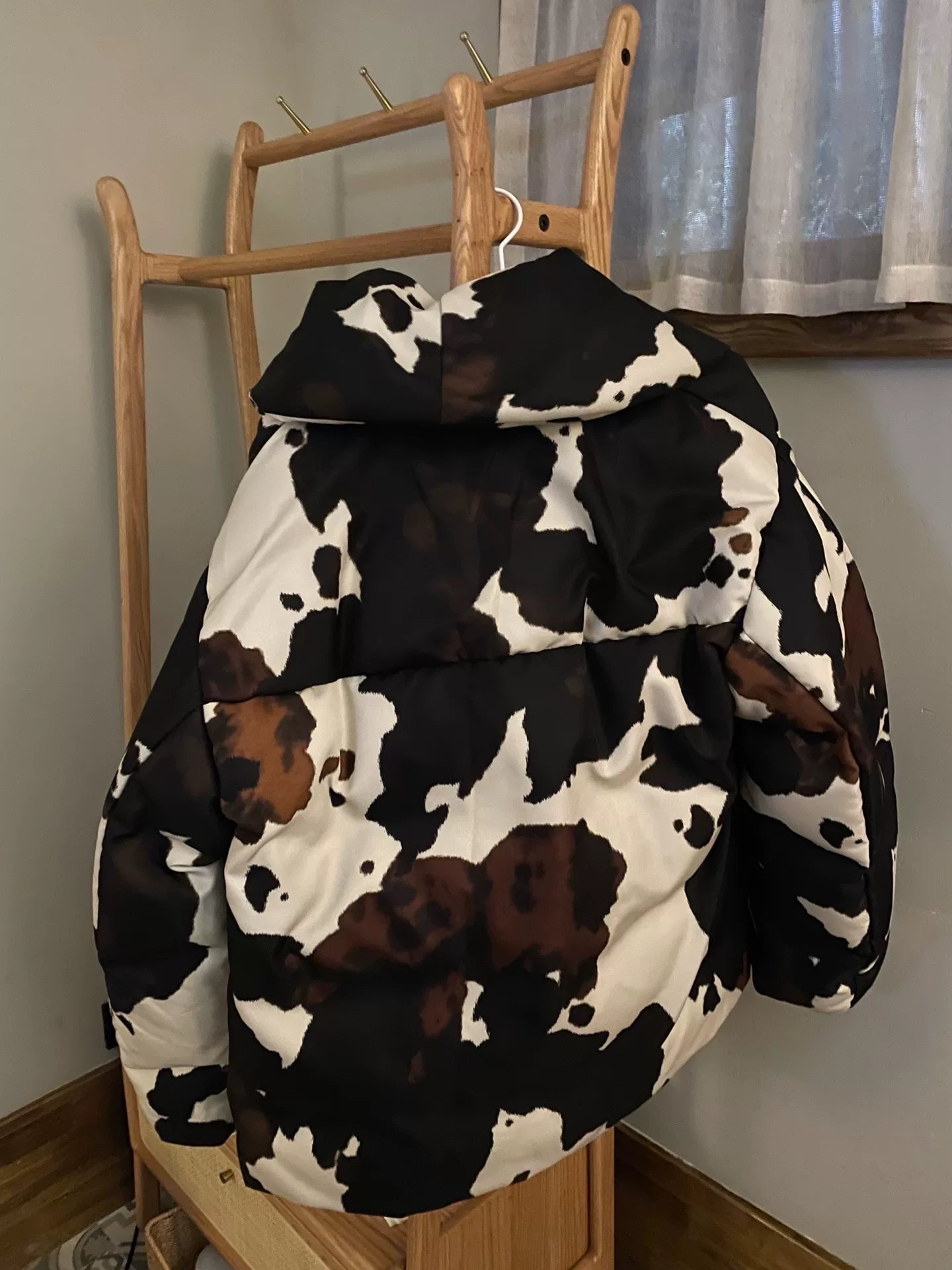 oversized black and white cow print coat