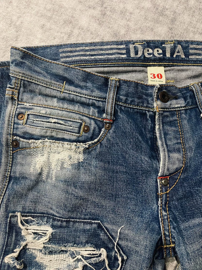 distressed low-rise blue denim jeans