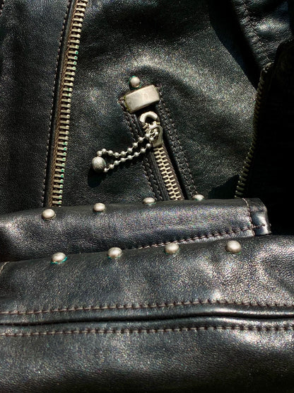 black leather biker jacket with detailed embellishments