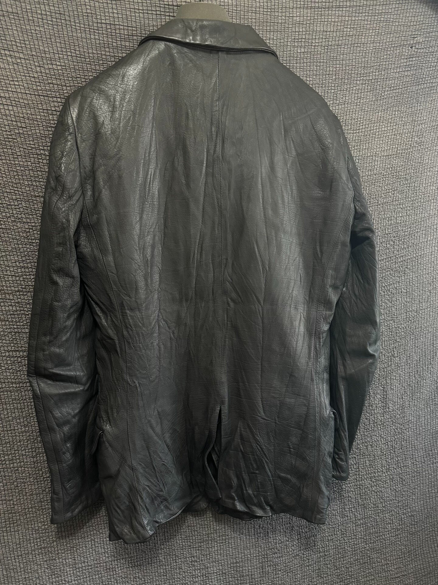 avant-garde crumpled leather suit jacket