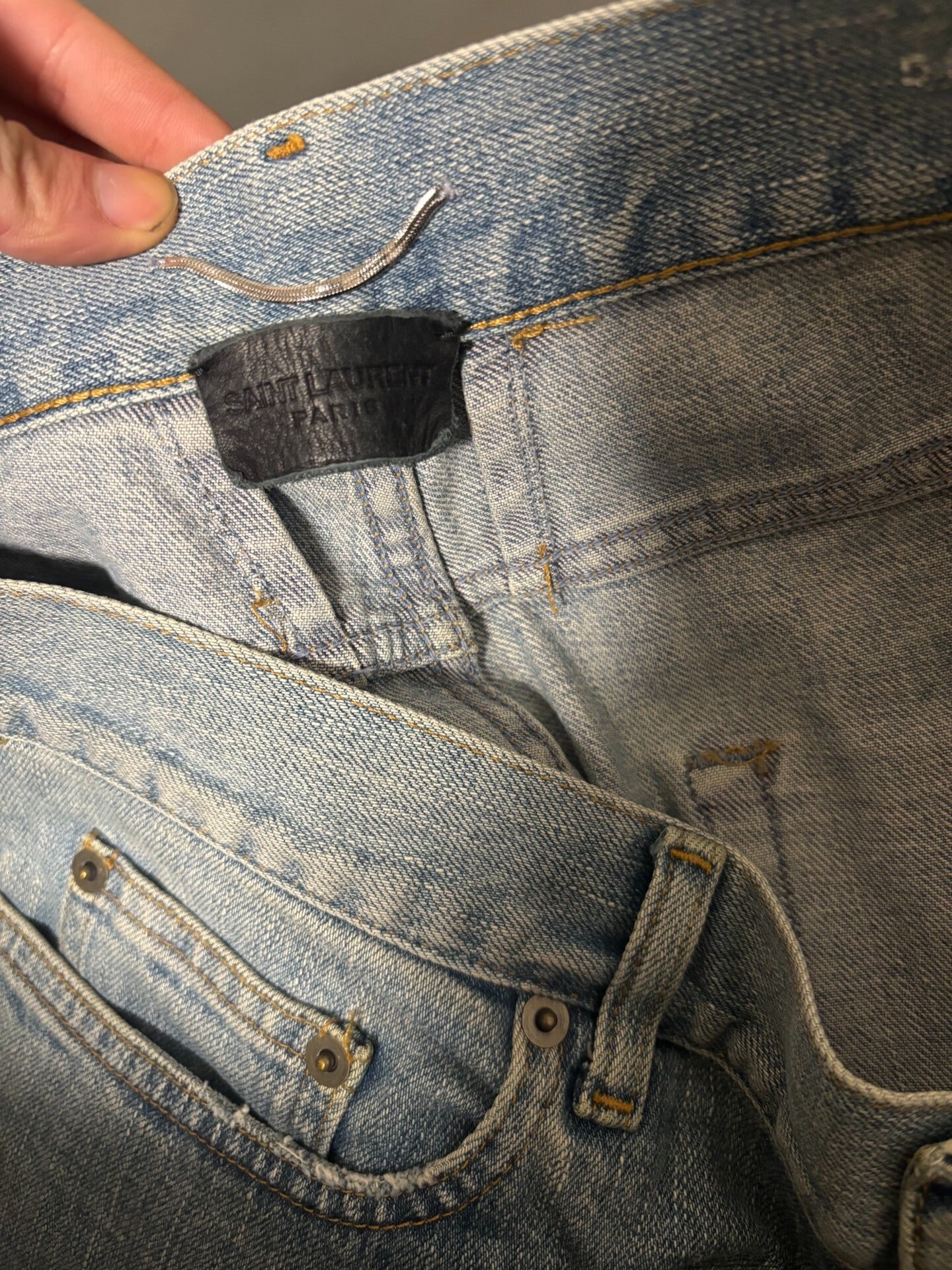 saint laurent ripped knee denim pants