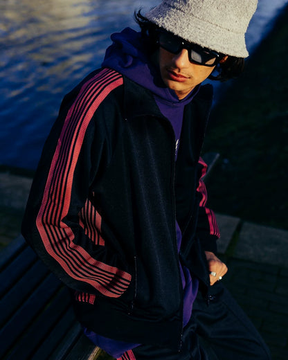 needles track jacket in black and pink