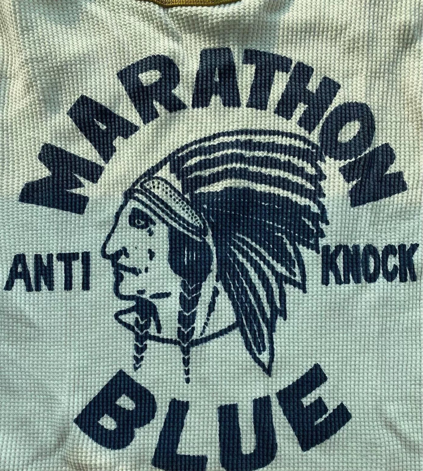 white and gold long sleeve graphic shirt