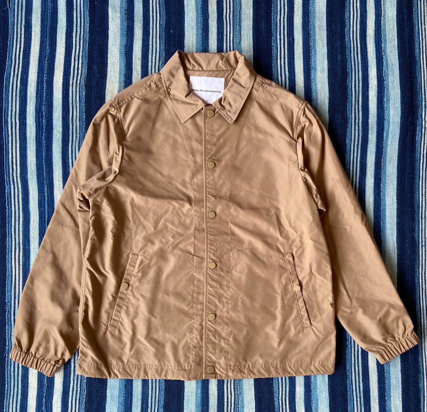 white mountaineering printed jacket