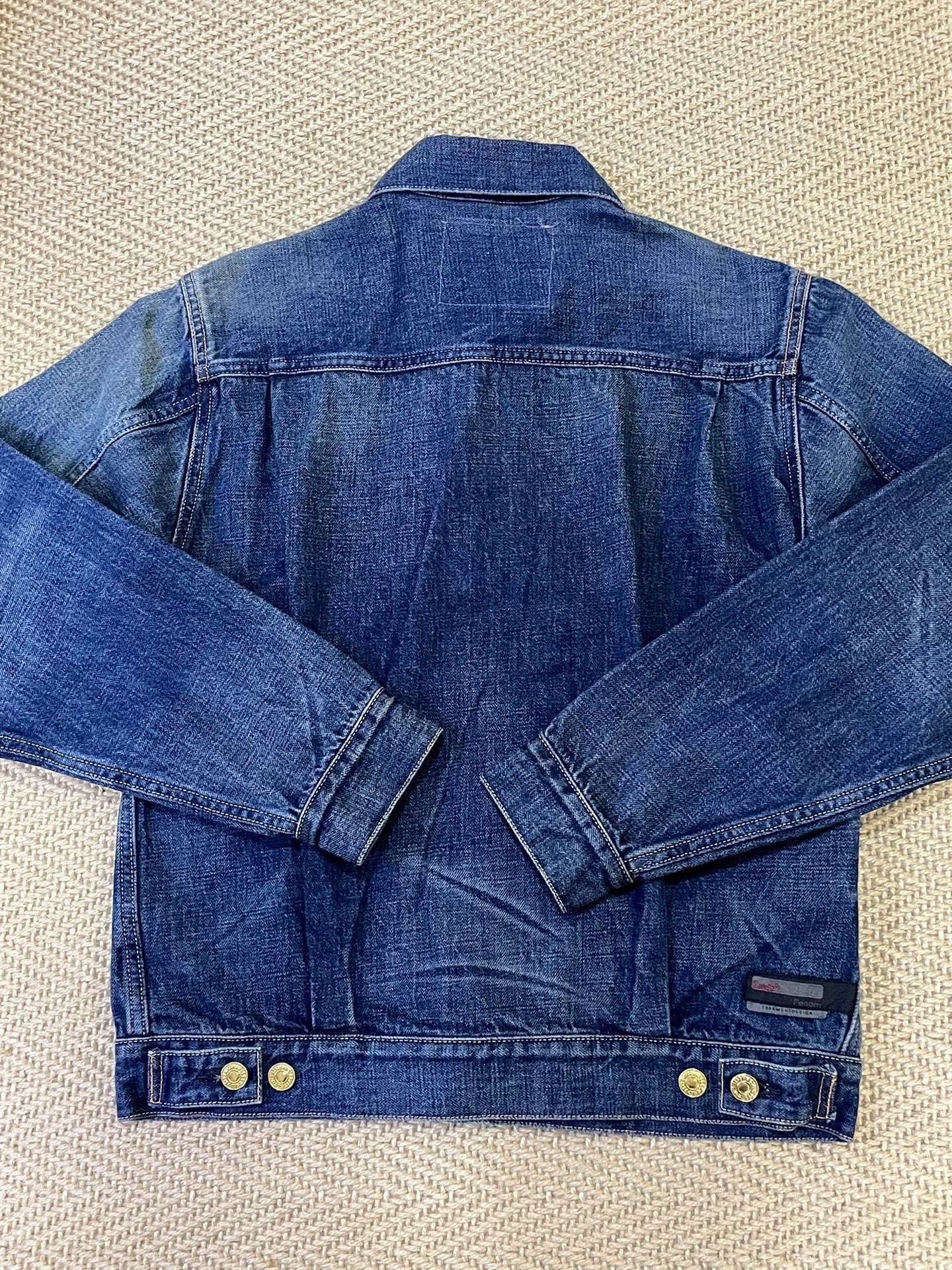 stylish blue denim jacket with gold buttons