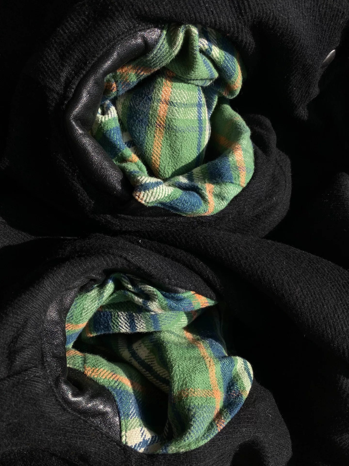 black leather biker jacket with detailed embellishments