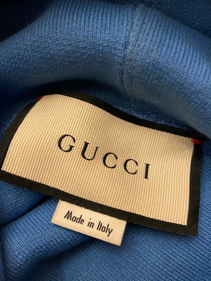 gucci blue hoodie with logo and stars