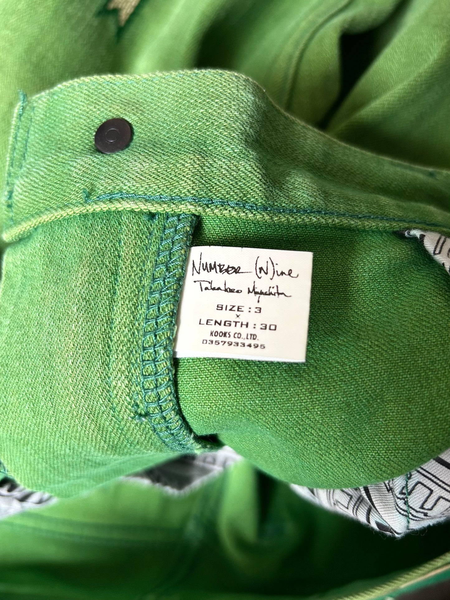 green embroidered denim pants by number(n)ine