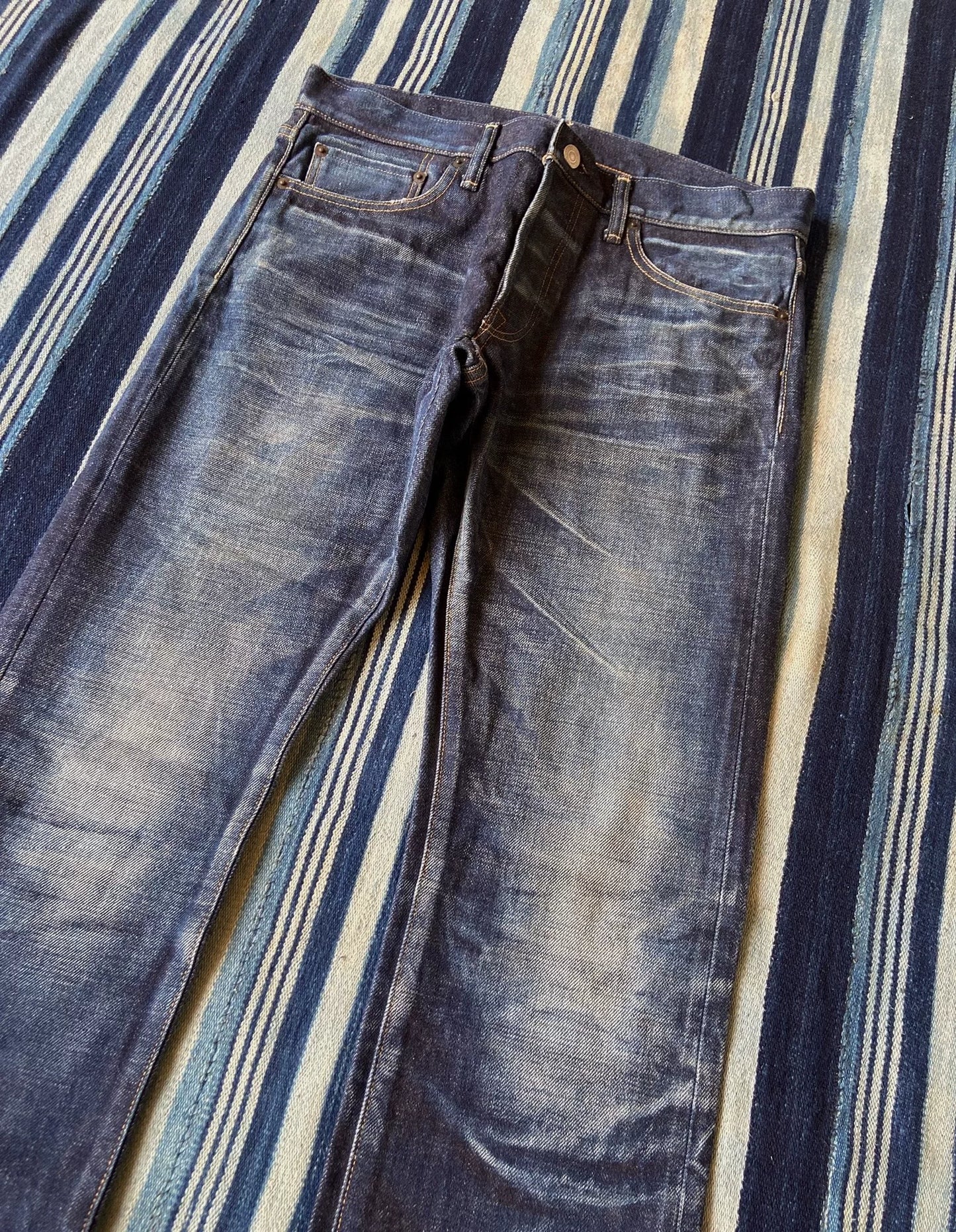 washed vintage-style raw denim jeans