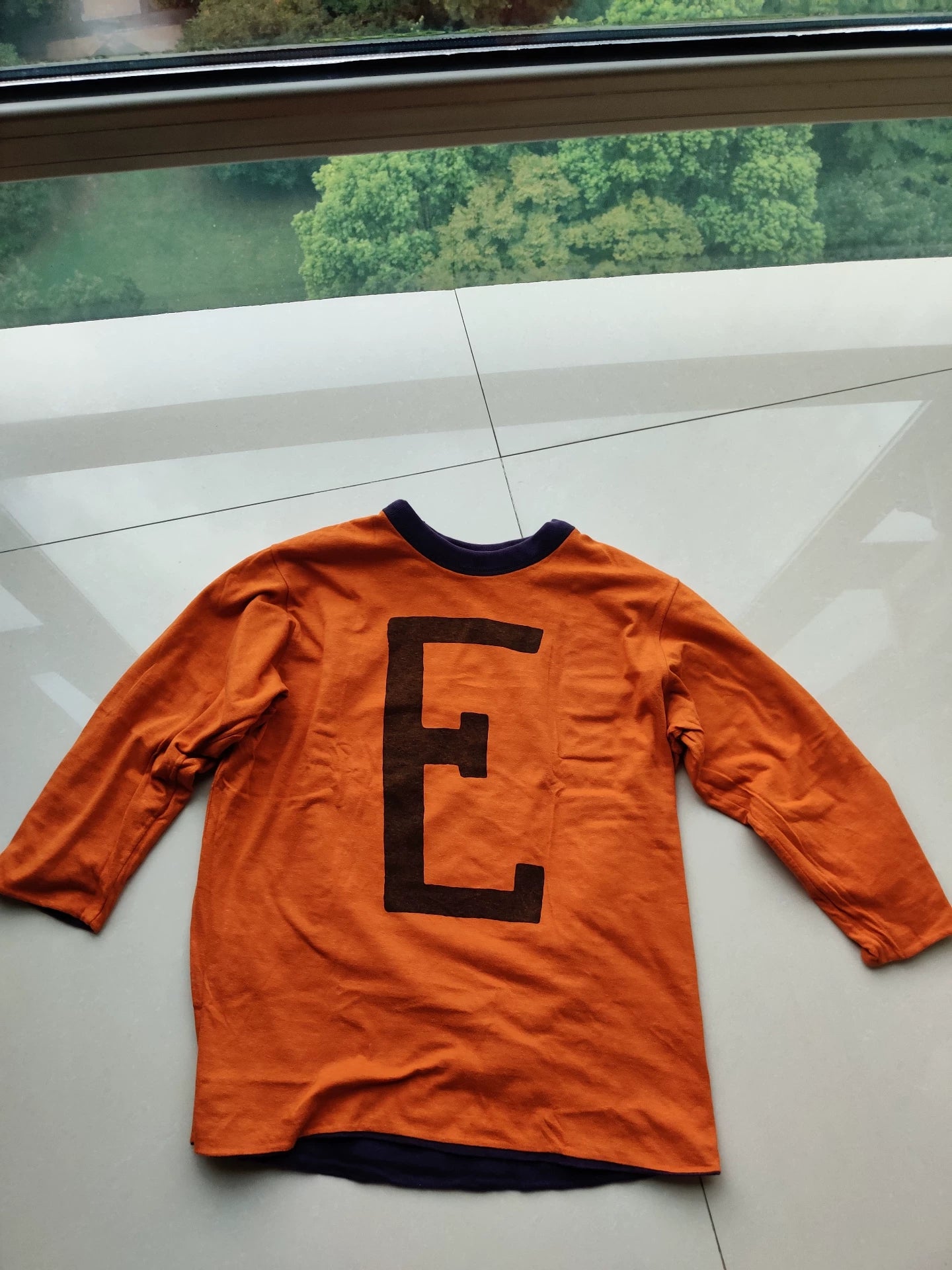 purple long sleeve jersey with graphic design