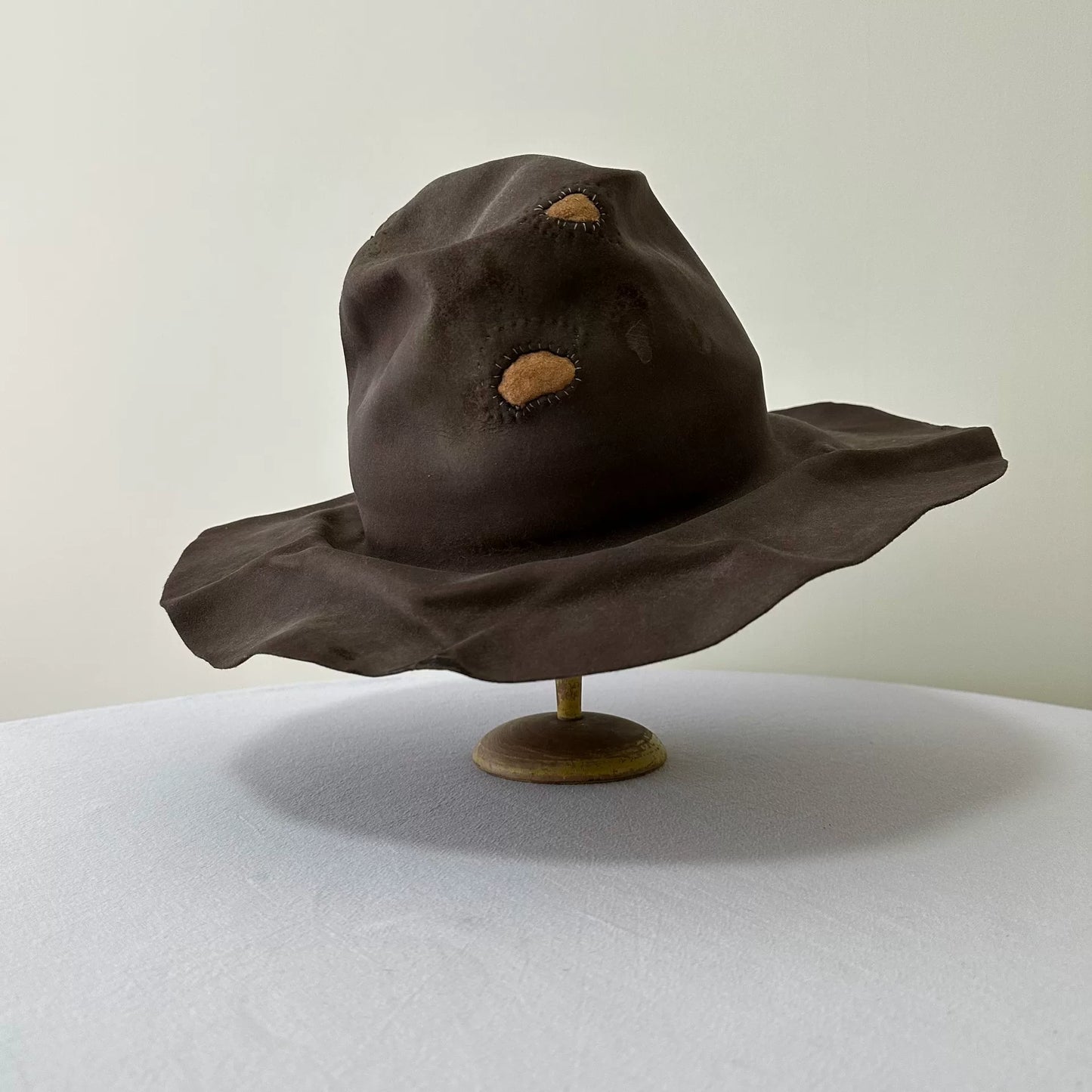 brown felt wide-brimmed hat
