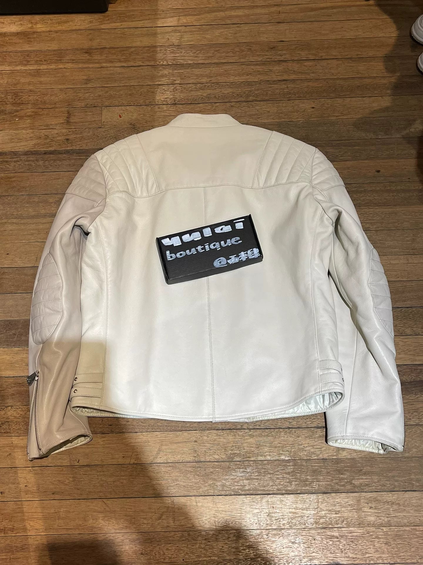 white leather motorcycle jacket by Alexander McQueen