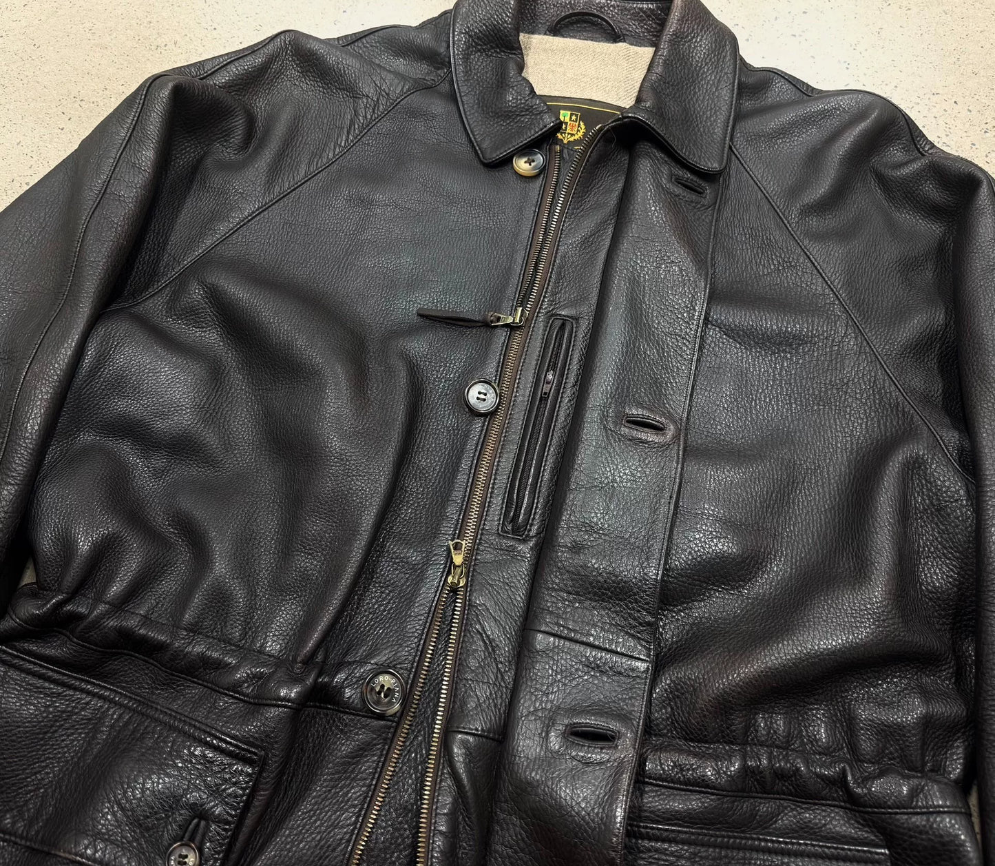 luxurious dark leather jacket with cashmere lining