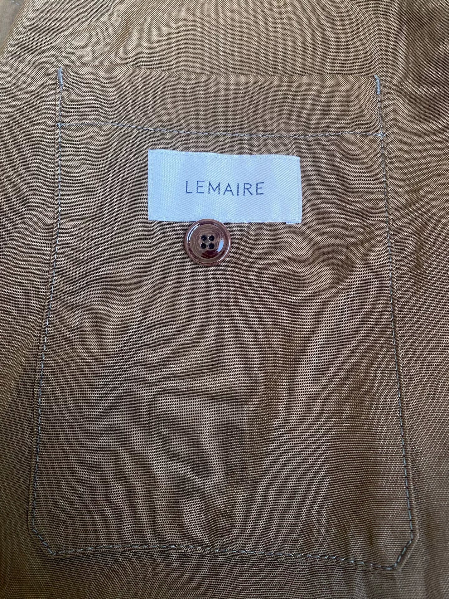 brown belted trench coat with military silhouette