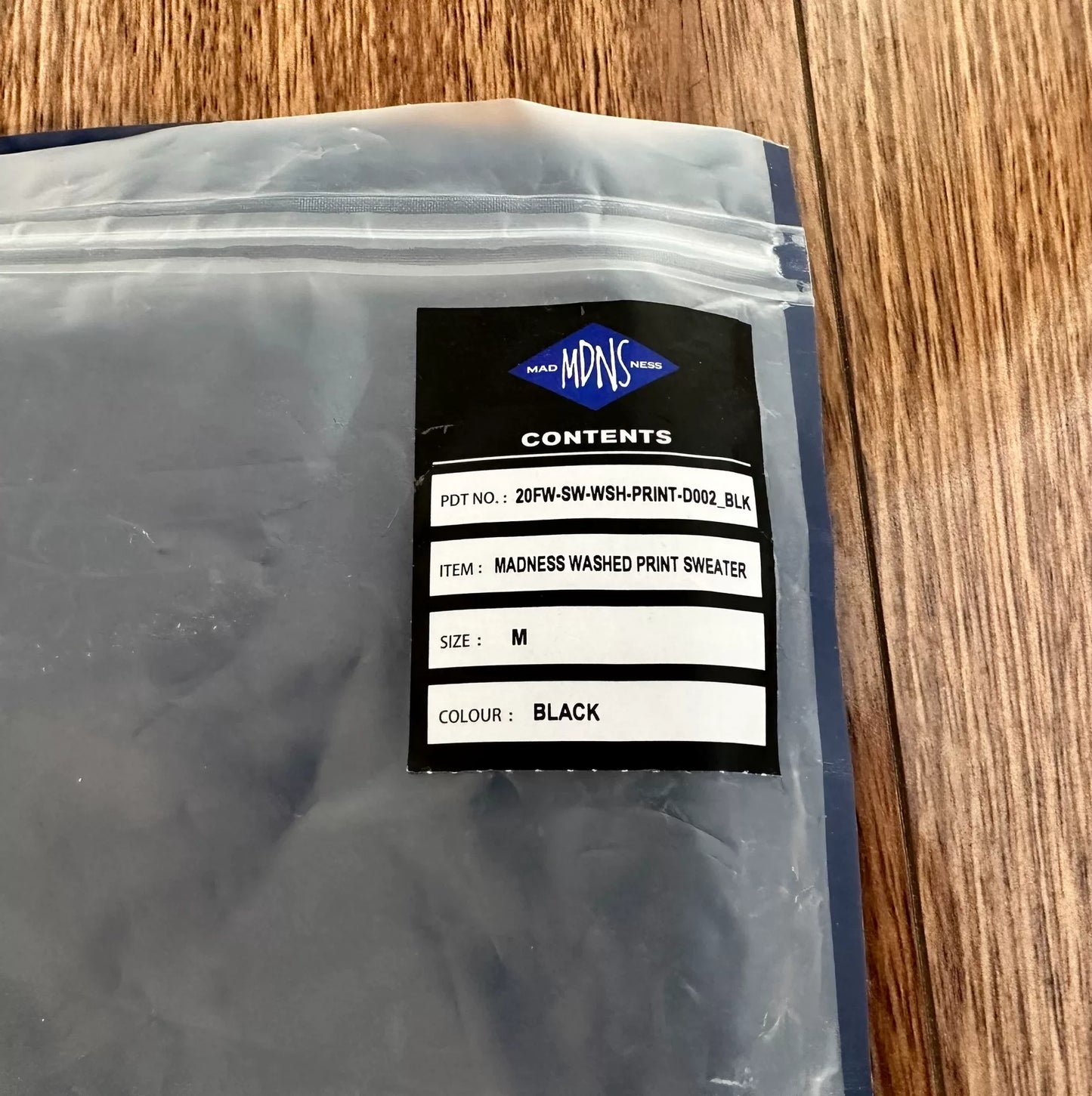 madness washed print sweater in black