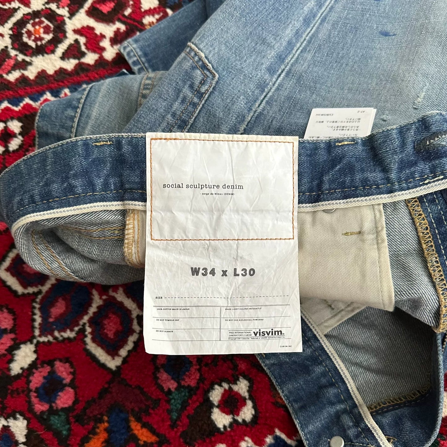 visvim mud-dyed wide-leg jeans