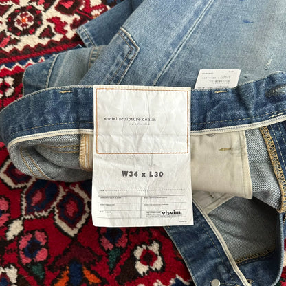 visvim mud-dyed wide-leg jeans