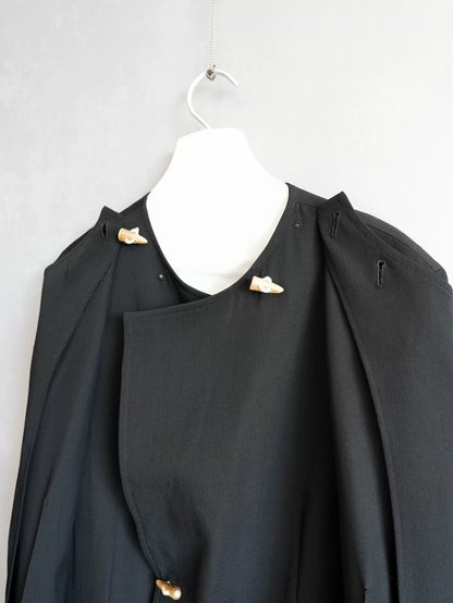 black double-breasted horn-button coat