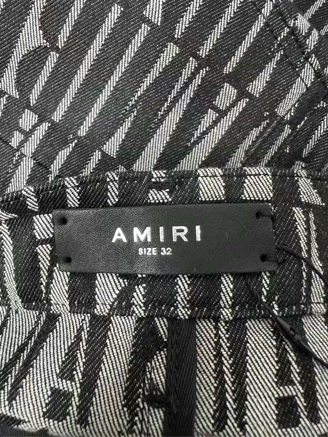 amiri logo detail side button jeans