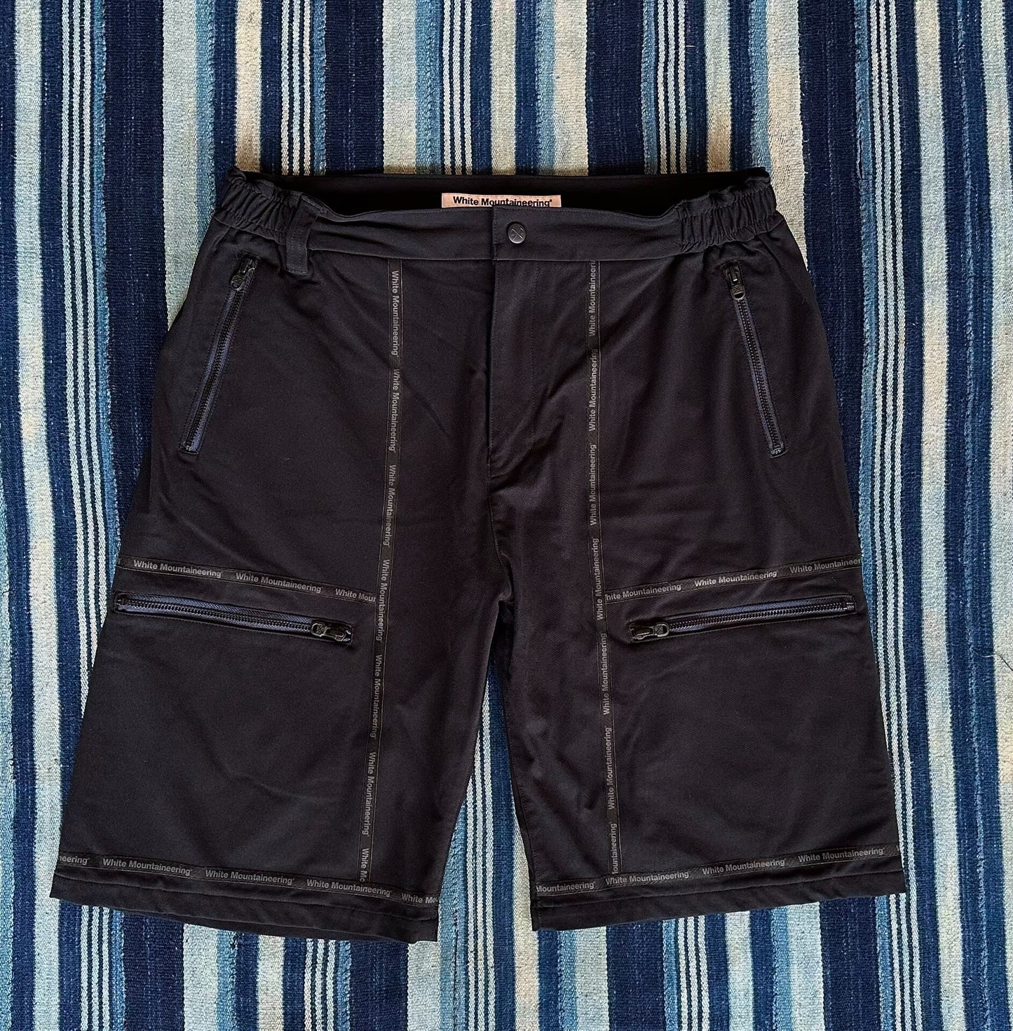 white mountaineering functional shorts with quick-dry fabric
