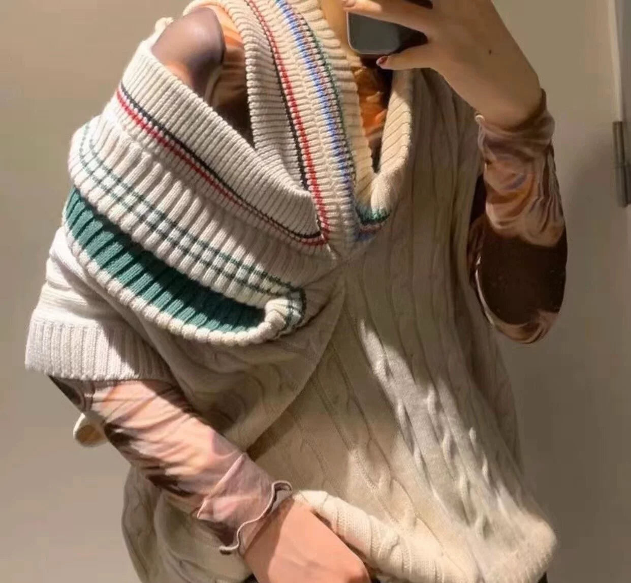 asymmetric knitted vest with multiple collars