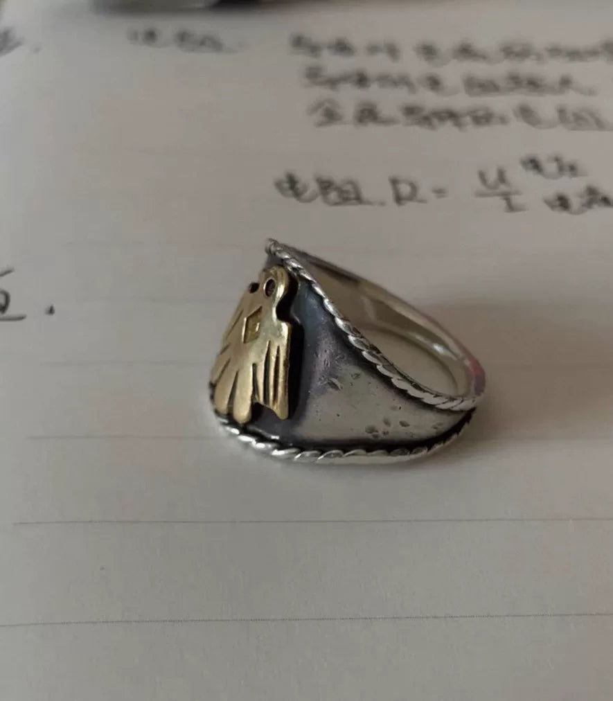 goros eagle ring with silver and gold details