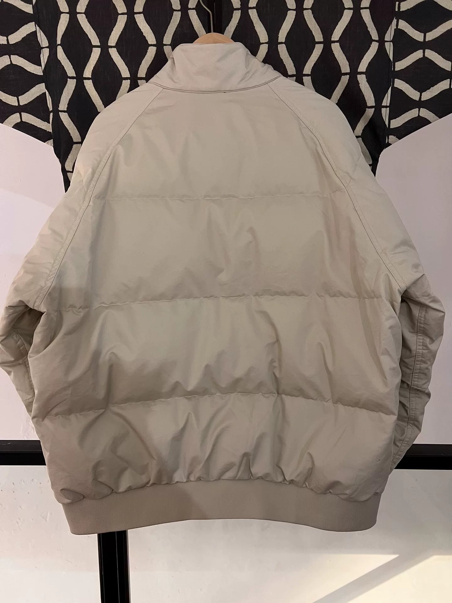 beige north face down jacket