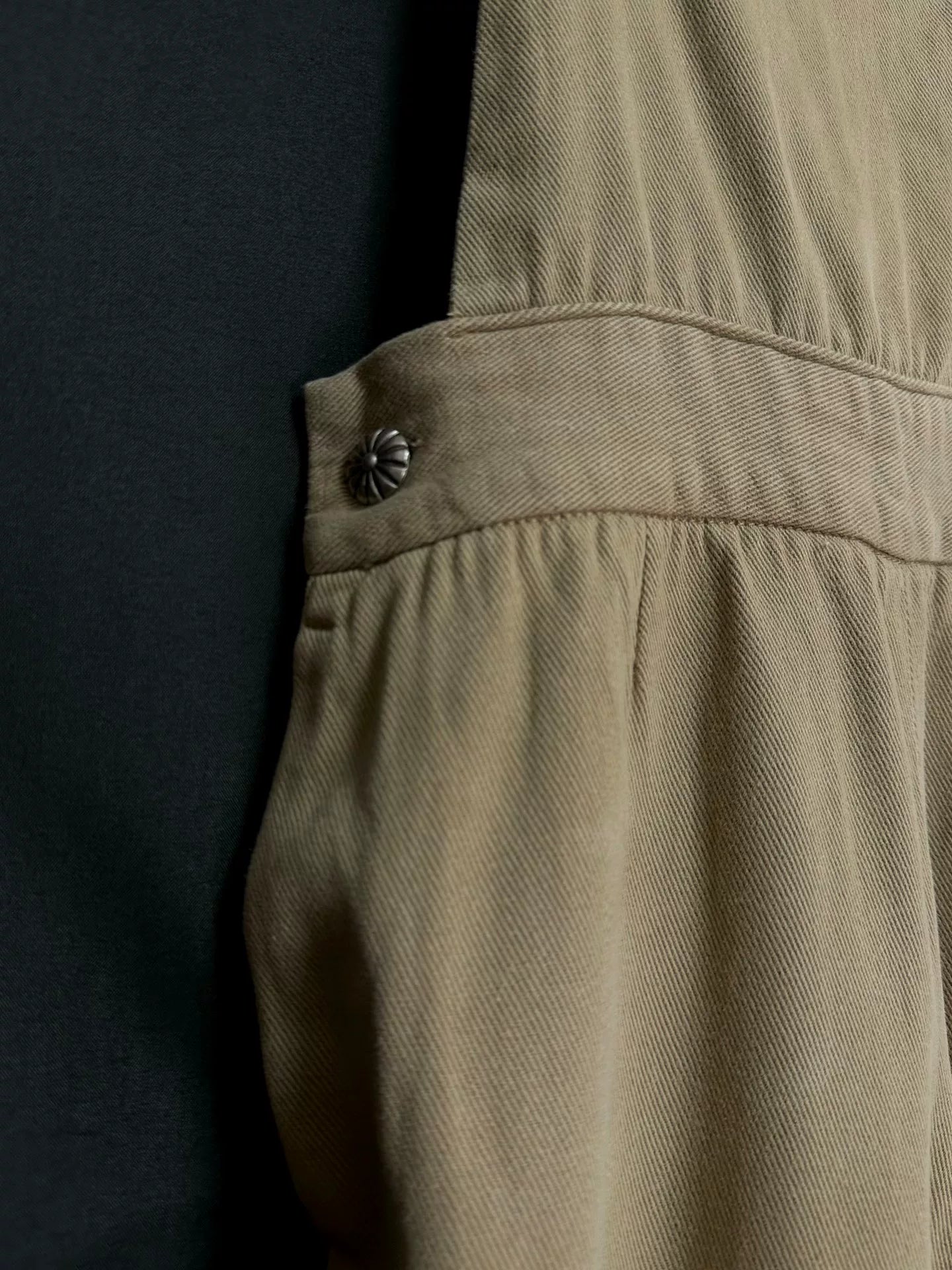 beige velvet overalls with silver buckles