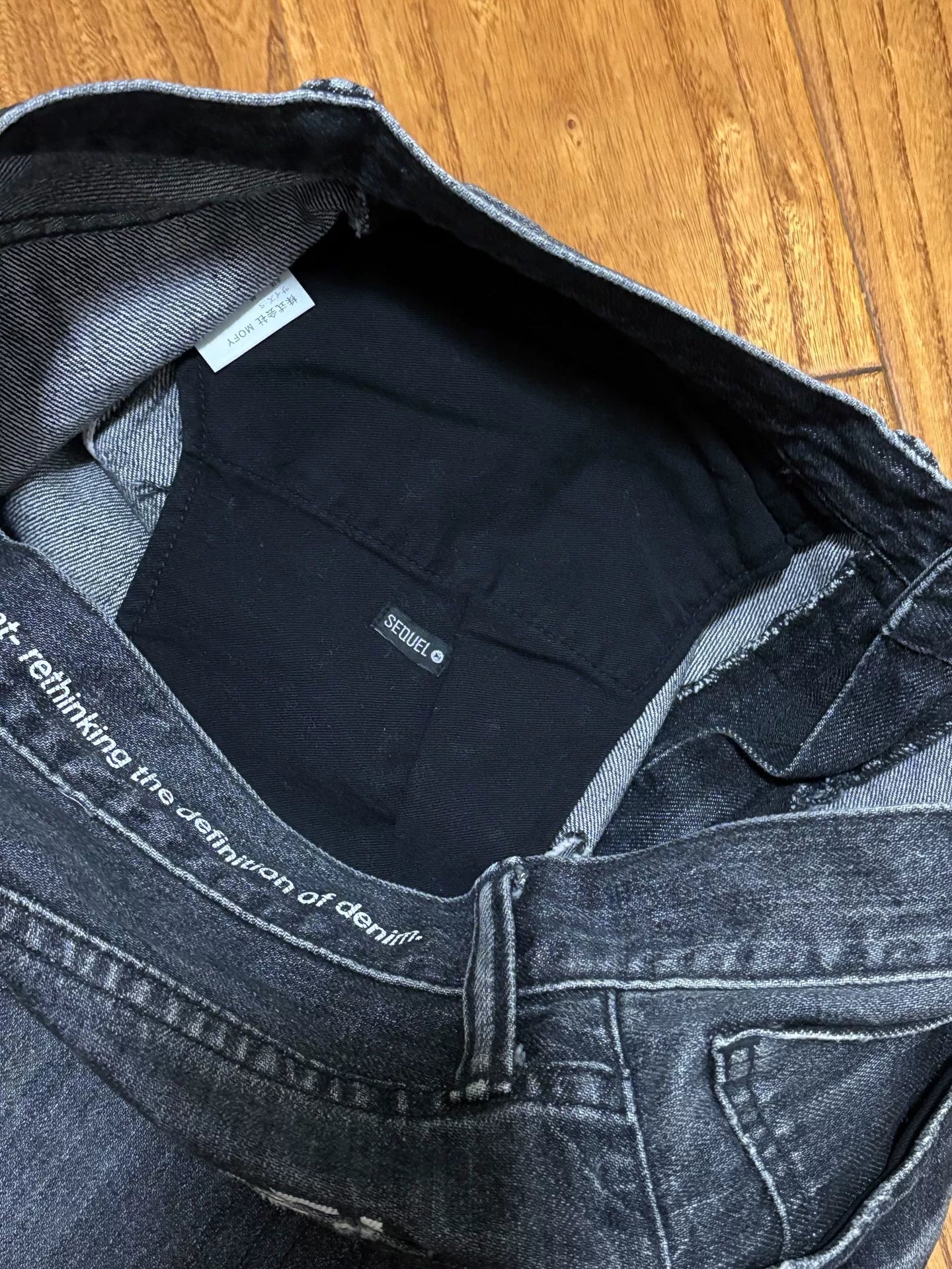 sequel fragment denim pants with distressing