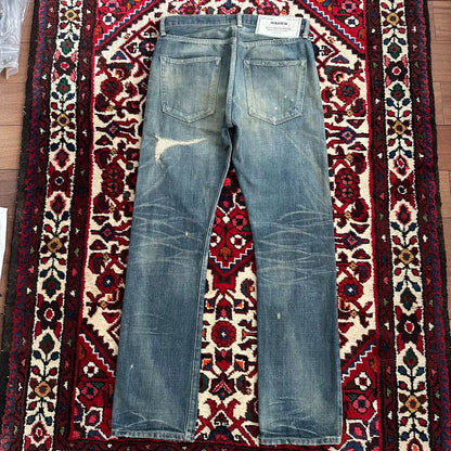 distressed blue jeans with unique detailing