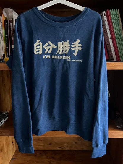 blue denim wash sweatshirt with text