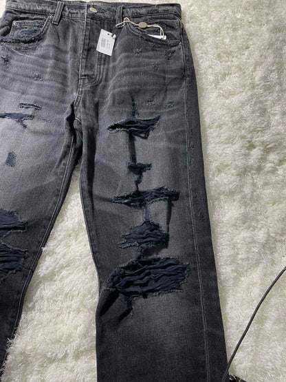 amiri destroyed slouch jeans in black