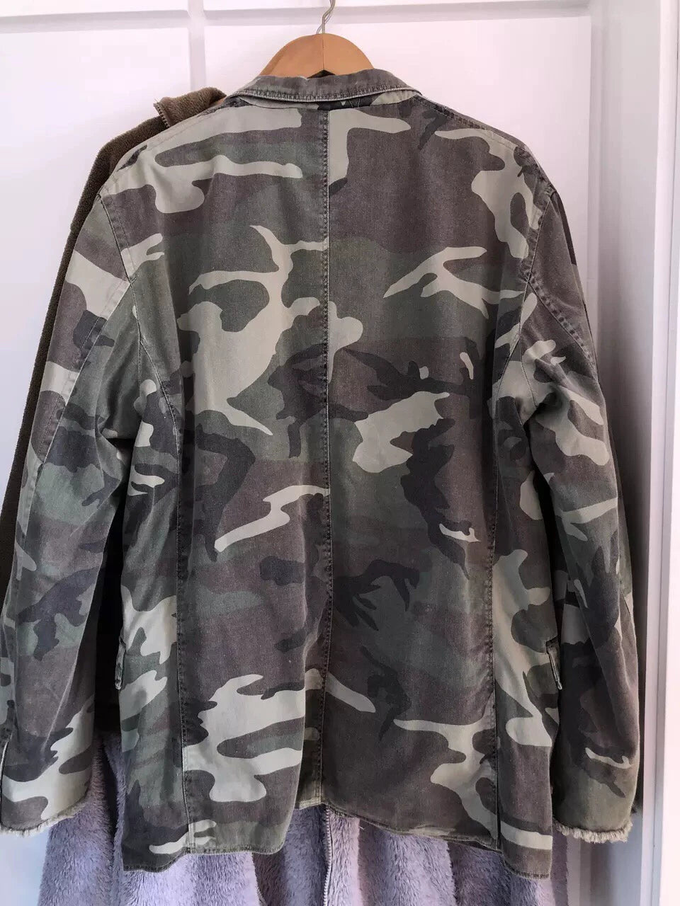 camo jacket with unique distressed details