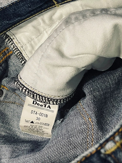 distressed low-rise blue denim jeans