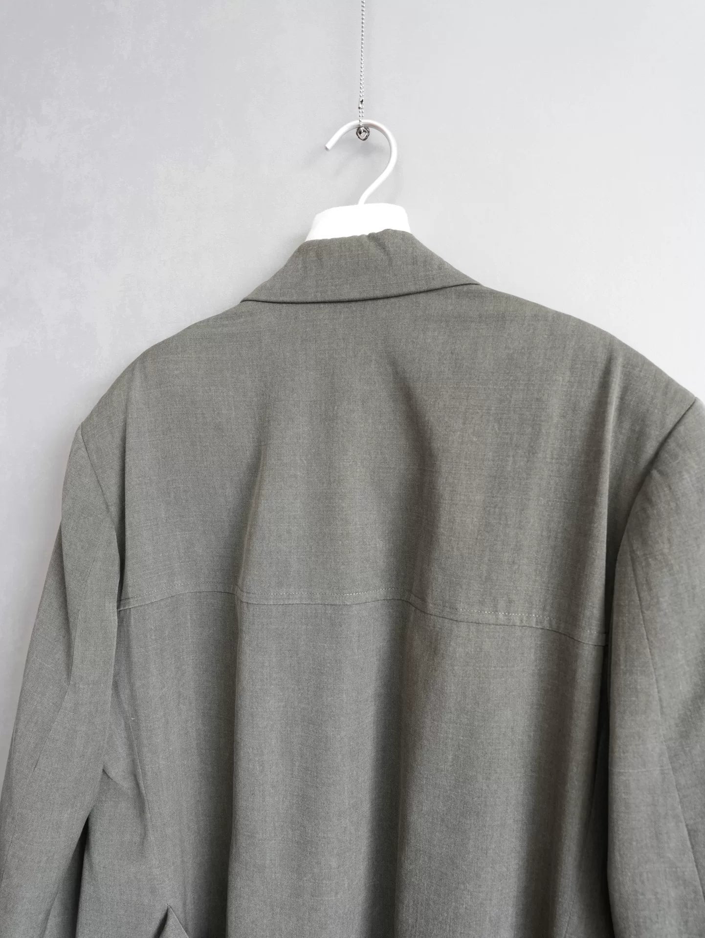 double-breasted concrete gray jacket